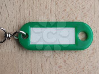 Green key ring with blank paper label with copy space