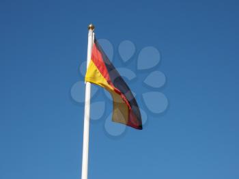 The German national flag of Germany, Europe over the blue sky