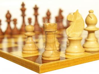 Wooden chessboard with light and dark wood checkers