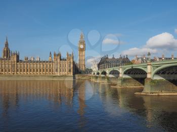 Houses of Parliament aka Westminster Palace and Westminster Bridge over River Thames in London, UK