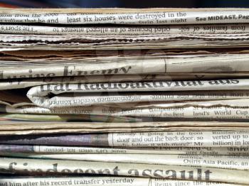 Detail of a pile of international newspapers
