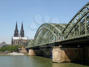 Koeln (Germany) panorama including the gothic cathedral and steel bridge over river Rhine