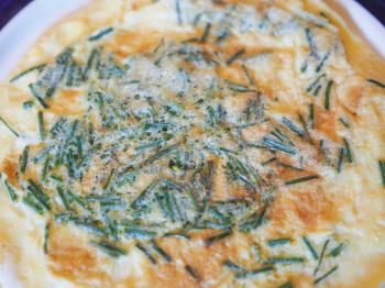 Eggs omelette with chives herb aka Allium schoenoprasum
