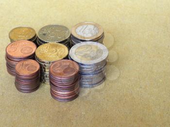 Pile of Euro coins currency of the European Union - selective focus on coins with blurred background copy space