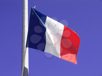 Flag of France over blue sky background
