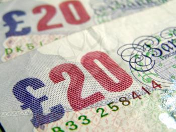 Detail of British Pound coins banknotes money