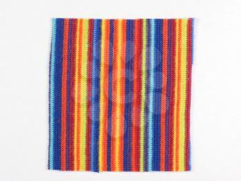 Multicolored striped fabric swatch over white background