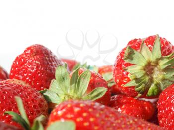 Detail of strawberries isolated over white with copy space