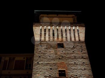 Night view of Torre Medievale medieval tower and castle in Settimo Torinese, Italy