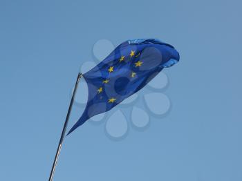 The national flag of European Union floating over blue sky