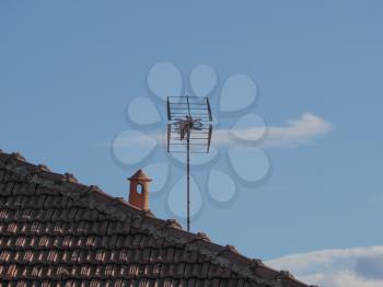 tv aerial (aka antenna) on a house roof