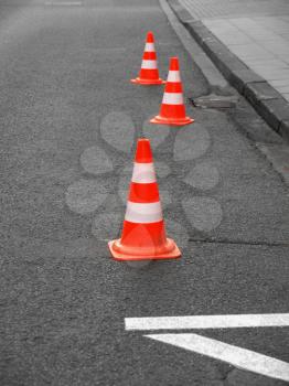Range of traffic cones for road works - Selective colour over desaturated background