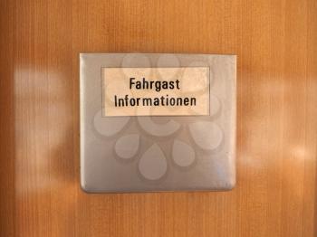 Fahrgast Informationen (meaning Passenger information) sign on vintage German tram