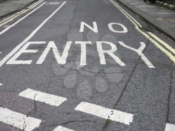 No entry sign written on street tarmac