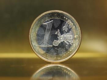1 euro coin money (EUR), currency of European Union over golden background with reflection