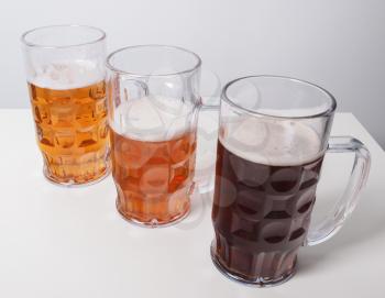 Many glasses of German beers including weiss dunkel and lager