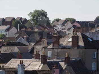 Typical British city roofscape and skyline with house chimneys