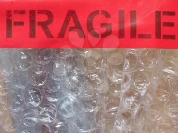 fragile warning sign label tag on bubble wrap packet