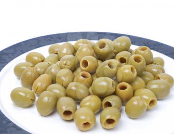 Green olives over a white background