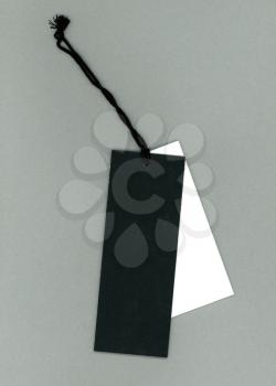 white and black tags over grey background