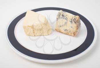 Traditional fine British cheeses including Cheddar and Stilton from the English Midlands - in a dish
