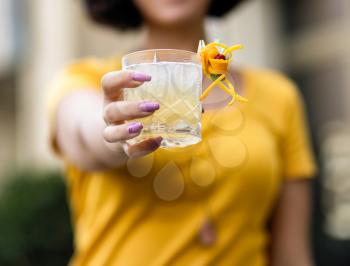 Woman holding a beautiful alcoholic cocktail glass