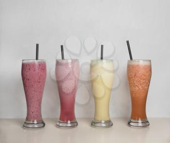 Fruit milky cocktails on a isolated white background