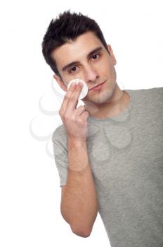 Royalty Free Photo of a Man Cleaning His Face