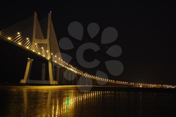Royalty Free Photo of a Night Shoot of Vasco da Gama Bridge in Lisbon, Portugal
