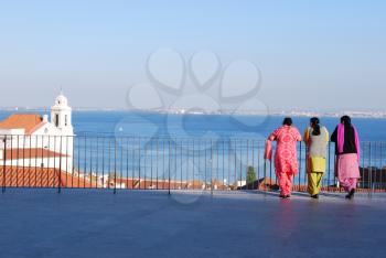 Royalty Free Photo of Women Looking at the River Tagus in Lisbon, Portugal