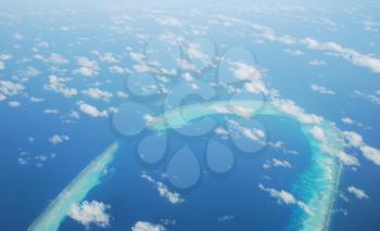 Royalty Free Photo of a View of Maldives Island and Clouds