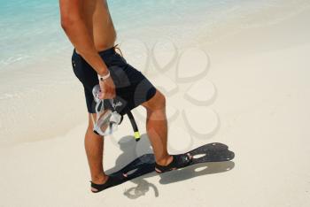 Royalty Free Photo of a Man Getting Ready to Snorkel