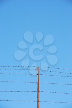 Royalty Free Photo of a Barbwire Fence