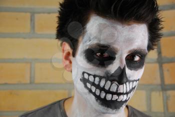 Royalty Free Photo of a Man With His Face Painted 

