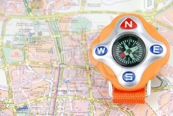 Royalty Free Photo of an Orange Compass on a City Map
