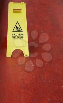 Royalty Free Photo of a Yellow Caution Wet Floor Sign