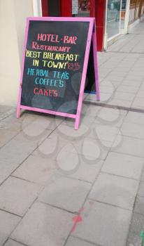 Royalty Free Photo of a Restaurant Menu on the Street