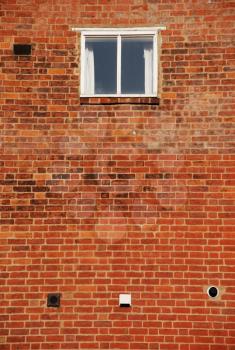 Royalty Free Photo of a Window on a Brick Wall