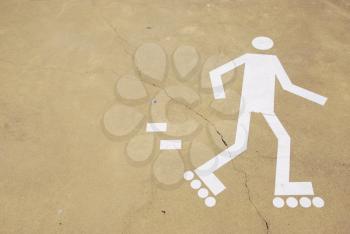 Royalty Free Photo of a Rollerblading Sign