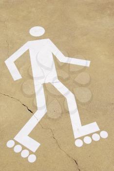 Royalty Free Photo of a Rollerblading Sign