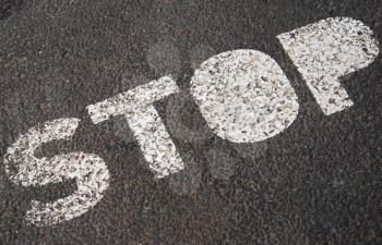Royalty Free Photo of a Stop Sign on Asphalt