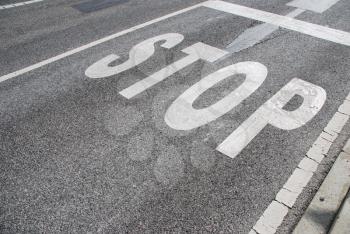 Royalty Free Photo of a Stop Sign Painted on Asphalt