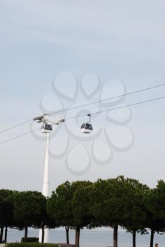 Royalty Free Photo of Two Modern Cable-cars in Nations Park in Lisbon, Portugal