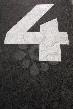 Royalty Free Photo of the Number Four on Asphalt