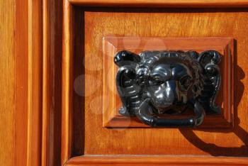 Royalty Free Photo of a Vintage Lion Metal Handle on a Door