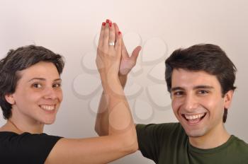 Royalty Free Photo of Siblings Giving a High Five