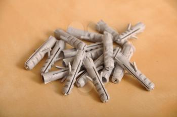 Royalty Free Photo of a Pile of Plastic Straddling Dowels
