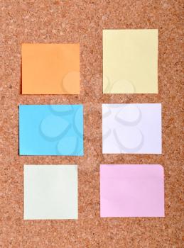 Royalty Free Photo of Sticky Notes on a Bulletin Board