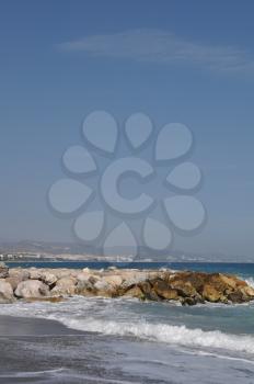 Royalty Free Photo of a Beach With a Stone Pier in Puerto Banus Marbella, Spain