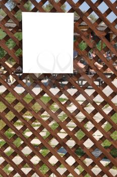 Royalty Free Photo of a Card on a Wooden Fence